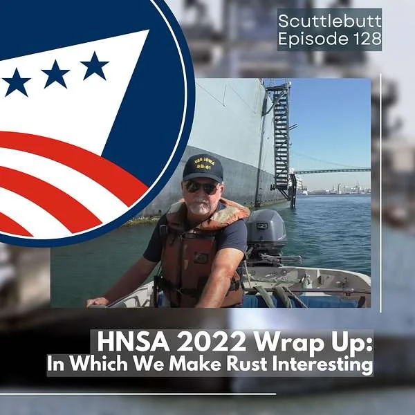 A man in a life vest and cap sits in a boat on the water, with a large ship and a bridge in the background. Text: Scuttlebutt Episode 128. HNSA 2022 Wrap Up: In Which We Make Rust Interesting. Navy-themed logo is at top left—because even when it comes to corrosion and coatings, there’s always something new to learn afloat or ashore.