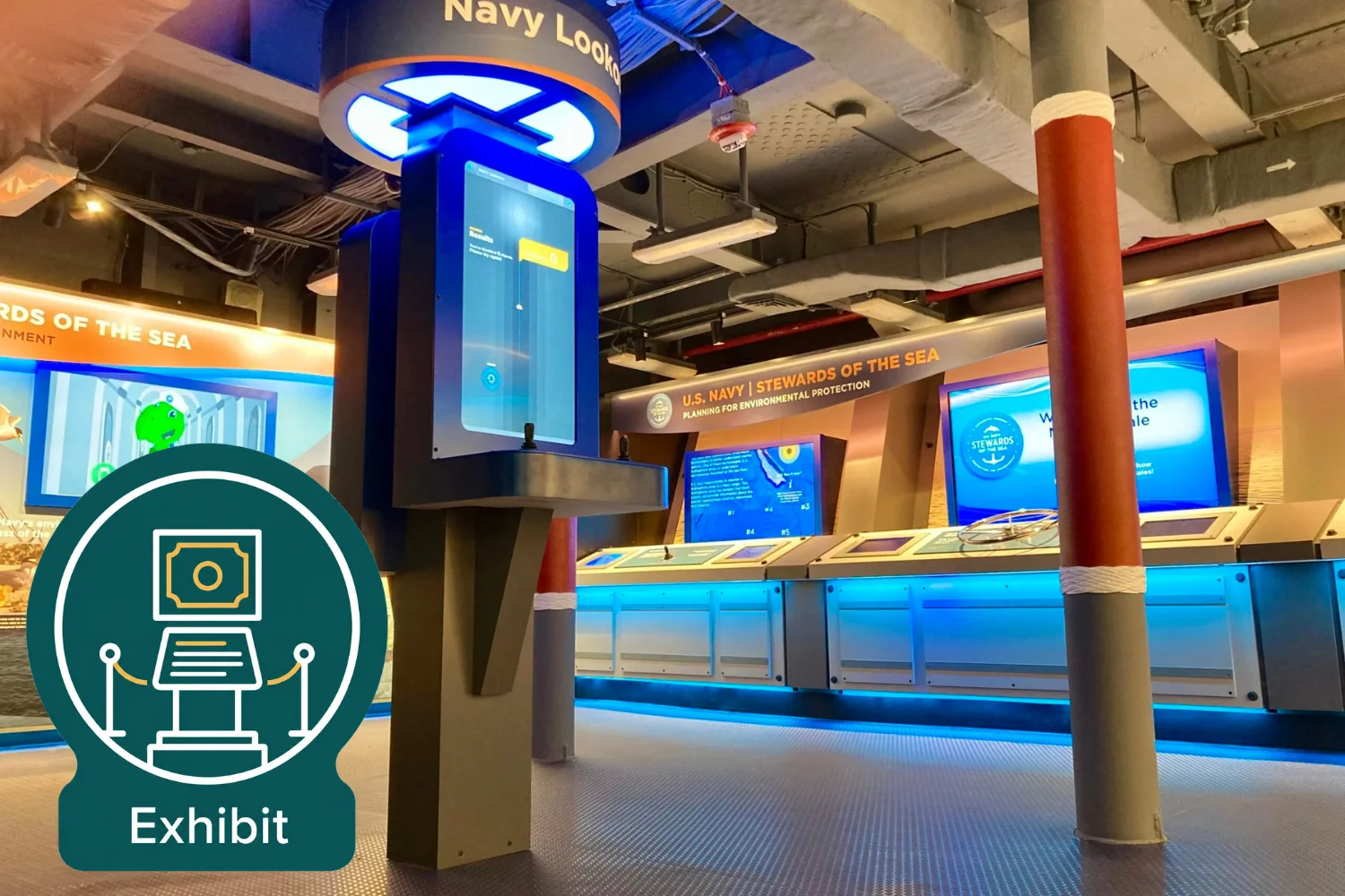 A modern museum exhibit features interactive digital displays with blue lighting, a sign reading Navy Lookout, and educational panels about the U.S. Navy and ocean stewardship. Visitors can explore how the Navy protects the seas through engaging content and hands-on activities. An Exhibit icon appears in the foreground.